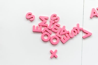 Pink, text, letter and magnet